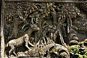 Pura Luhur Batukau - Bali - The Kulkul alarm tower, details of the scenes in the panels of the basement. 