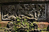 Pura Luhur Batukau - Bali - The Kulkul alarm tower, details of the scenes in the panels of the basement. 