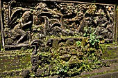 Pura Luhur Batukau - Bali - The Kulkul alarm tower, details of the scenes in the panels of the basement. 