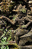 Pura Luhur Batukau - Bali - The Kulkul alarm tower, details of the scenes in the panels of the basement. 