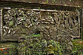 Pura Luhur Batukau - Bali - The Kulkul alarm tower, details of the scenes in the panels of the basement. 