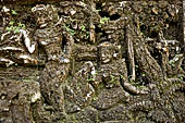 Pura Luhur Batukau - Bali - The Kulkul alarm tower, details of the scenes in the panels of the basement.