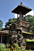 Pura Luhur Batukau - Bali - The Kulkul alarm tower with statues of directional protectors. 