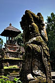 Pura Luhur Batukau - Bali - The Kulkul alarm tower with statues of directional protectors. 