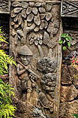 Pura Meduwe Karang - Bali - Reliefs adorning the basement walls of the central shrine, which show people and scenes from everyday life.