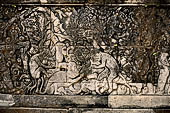 Pura Meduwe Karang - Bali - Reliefs adorning the basement walls of the central shrine, which show people and scenes from everyday life.