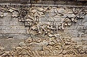 Pura Meduwe Karang - Bali - Reliefs adorning the basement walls of the central shrine, which show people and scenes from everyday life.