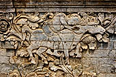 Pura Meduwe Karang - Bali - Reliefs adorning the basement walls of the central shrine, which show people and scenes from everyday life. 