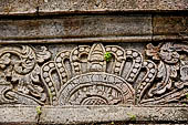 Pura Meduwe Karang - Bali - Reliefs adorning the basement walls of the central shrine, which show people and scenes from everyday life. 