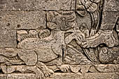 Pura Meduwe Karang - Bali - Reliefs adorning the basement walls of the central shrine, which show people and scenes from everyday life. 