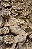 Pura Meduwe Karang - Bali - Reliefs adorning the basement walls of the central shrine, which show people and scenes from everyday life.