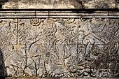 Pura Meduwe Karang - Bali - Reliefs adorning the basement walls of the central shrine, which show people and scenes from everyday life.