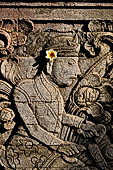 Pura Meduwe Karang - Bali - The famous relief of the Cyclist, a westerner on a bicycle is depicted on the side of the main shrine. 