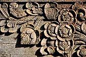 Pura Meduwe Karang - Bali - Reliefs adorning the basement walls of the central shrine, which show people and scenes from everyday life.