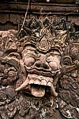 Pura Beji Sangsit , Bali, Candi Bentar at the entrance of the temple, details of the sculptures.