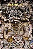 Pura Beji Sangsit , Bali, covered gate (Kori Agung) of the inner courtyard, details of the sculptures.