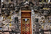 Pura Beji Sangsit , Bali, covered gate (Kori Agung) of the inner courtyard, details of the sculptures.