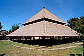 Pura Taman Ayun - Bali. Large double roofed pavilion with statues representing the a cock fighting scene.