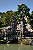 Pura Taman Ayun - Bali. The temple is accessed by a bridge guarded by the usual door guardians and the first Candi Bentar.