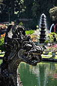 Tirtagangga, Bali - Detail of the bridge of the south pond with the fountain tower in the background. 