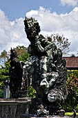 Tirtagangga, Bali - Detail of the statues around the fountain tower in the middle of the garden.