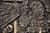 Chichen Itza - Great Ball court. Detail of the bas-reliefs on the side benches.