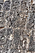 Chichen Itza - Great Ball court. Detail of the bas-reliefs on the side benches.