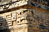 Chichen Itza - The Monjas (Nunnery) palace complex. Eastern patio, eastern facade of the church, the corner 'big nosed' mask. 