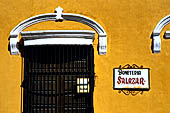 Izamal - low Spanish colonial houses, most of the buildings facades are painted a glowing ochre colour.