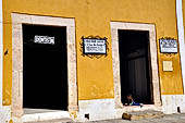 Izamal - low Spanish colonial houses, most of the buildings facades are painted a glowing ochre colour.