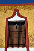 Izamal - low Spanish colonial houses, most of the buildings facades are painted a glowing ochre colour.