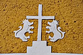 Izamal - low Spanish colonial houses, most of the buildings facades are painted a glowing ochre colour.