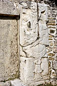 Palenque - The Palace. Patio of the Captives (Patio de los Cautivos), images at base of House C first captive from right wearing a 'k'in' (sun) symbol in his headdress. 