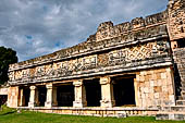 Uxmal - The Nunnery Quadrangle, the North Building. Temple of Venus at the left of grand staircase with 4 square monolithic columns.  