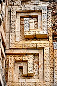 Uxmal - Palace of the Governor, front (East) facade. The frieze represents 'meanders' which rotate in opposite verse. 