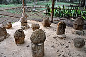 Uxmal - Group of stone phallus near the Pyramid of the Old Woman. 