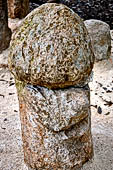 Uxmal - Group of stone phallus near the Pyramid of the Old Woman. 