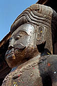 Bhaktapur - Tachupal Tole. Dattatraya Temple. Statue of wrestlers guarding the temple.