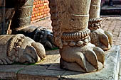 Bhaktapur - Durbar Square - details of the big lion statue at the side of a gate entrance (now of a school).