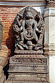 Bhaktapur - Durbar Square - detail of the statue of Hanuman (art gallery entrance) in its fierce aspect.