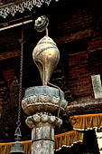 Bhaktapur - in a small courtyard on the southern side of the Tole the Til Mahadev Narayan temple. The sankha (conch)  on top of a pillar.