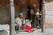 Bhaktapur - Golmadhi Square, where there is a deep hiti and the small three tiered temple dedicated to Golmadhi Ganesh and, nearby, a white chaitya.