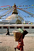 Bodhnath - Pilgrims circumambulate the external wall surrounding the stupa with 147 prayer wheels. 