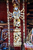 Changu Narayan - Roof Strut of first level  (south side of he West facade). The wooden sculpture represents Matsya, the fish avatara of Vishnu, fighting with the demon Hayagriva.