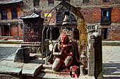 Changu Narayan - Statue of kneeled Garuda (v c) in front of the West facade of the temple.