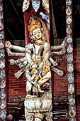 Changu Narayan - Roof strut of first level  (North facade). The wooden sculpture represents Balarama (?) avatar of Vishnu.