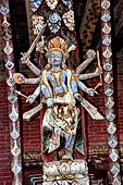 Changu Narayan - Roof strut of first level  (North facade). The wooden sculpture represents Parasurama, the sixth avatar of Vishnu. The deity is recognised by his axe.