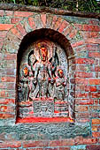 Changu Narayan - sculpture of the large platform of the NW side of the temple courtyard: Sridhar Narayan (IX C) Vishnu, Laxmi and Garuda standing on pedestals.