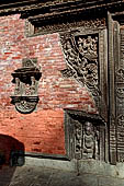 Gokarna Mahadev - richly carved triple wooden doorways.