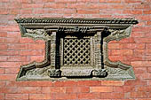 Kathmandu - Durbar Square. Detail of a wooden carved window of the  small Vishnu temple at the North-east end of the square.  